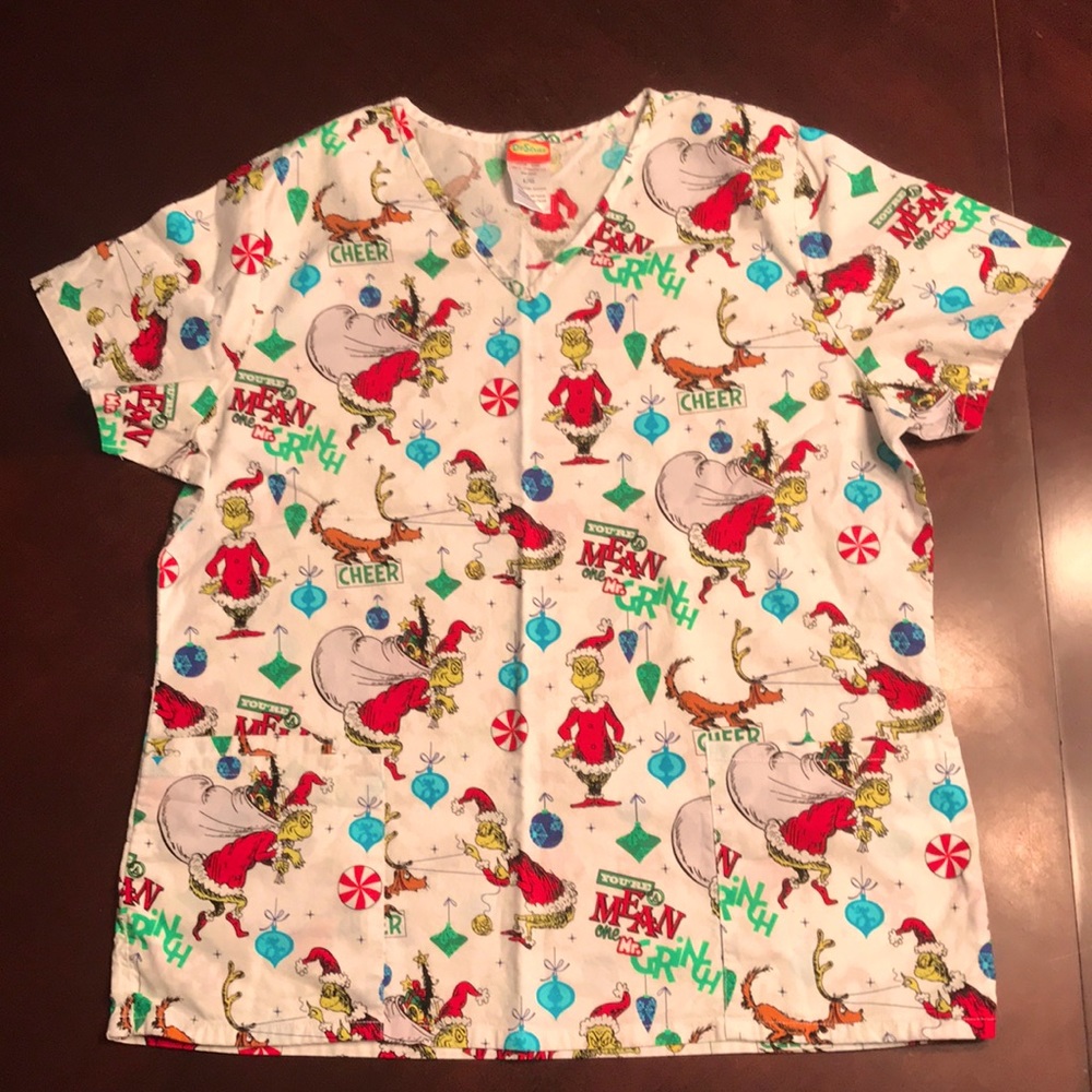 The Grinch patterned women’s scrub top